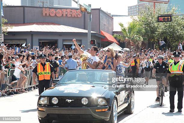 Mark Cuban, owner of the Dallas Mavericks rides along with his family and the Larry O'Brien trophy during the Mavericks NBA Champion Victory Parade...