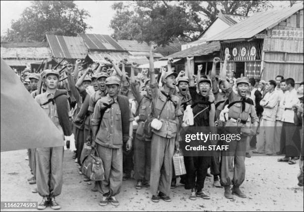 Propagandists and cultural communist workers up their fist and shout slogans upon their arrival in Sham Chum, three kilometers north of Hong-kong...