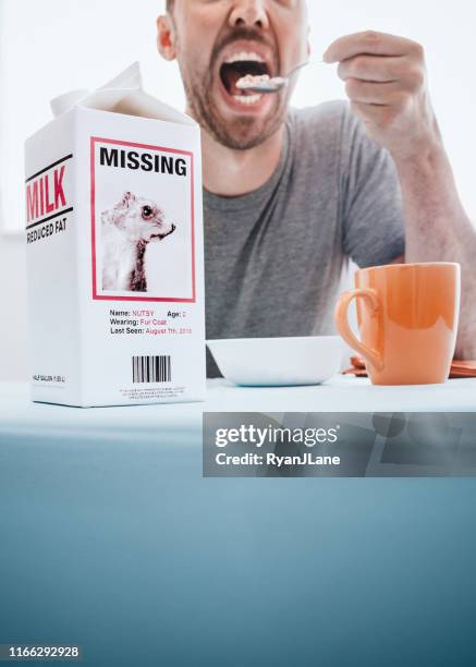 missing person milk carton with squirrel while man eats breakfast - milk carton stock pictures, royalty-free photos & images