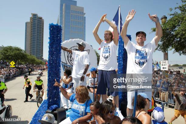 Jason Terry, Dirk Nowitzki and Jason Kidd of the Dallas Mavericks wave to fans during the Mavericks NBA Champion Victory Parade on June 16, 2011 at...