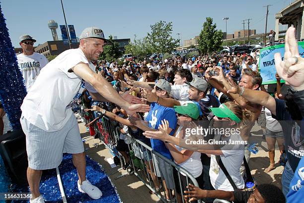 Jason Kidd of the Dallas Mavericks high fives fans along the route during the Mavericks NBA Champion Victory Parade on June 16, 2011 at the American...