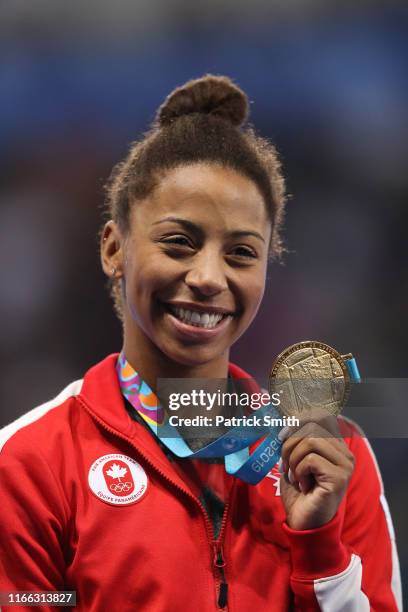 Jennifer Abel of Canada celebrates with the gold medal after winning the Women's Diving 3m Springboard Final on Day 10 of Lima 2019 Pan American...