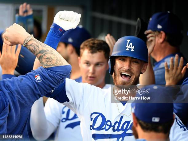 Cody Bellinger of the Los Angeles Dodgers celebrates his three run homerun in the dugout, to take a 3-0 lead over the St. Louis Cardinals, during the...