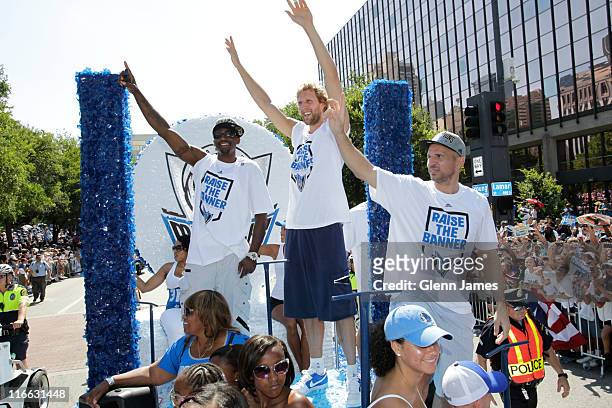 Jason Terry, Dirk Nowitzki and Jason Kidd of the Dallas Mavericks wave to the crowd during the Mavericks NBA Champion Victory Parade on June 16, 2011...