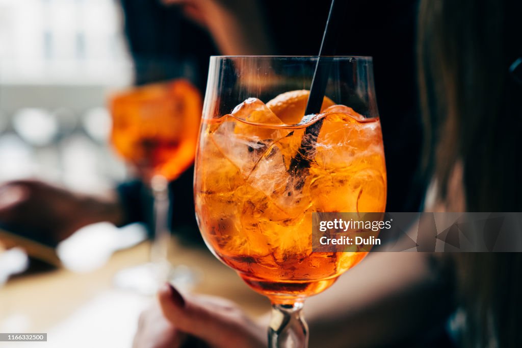 Two women with Spritz drinks