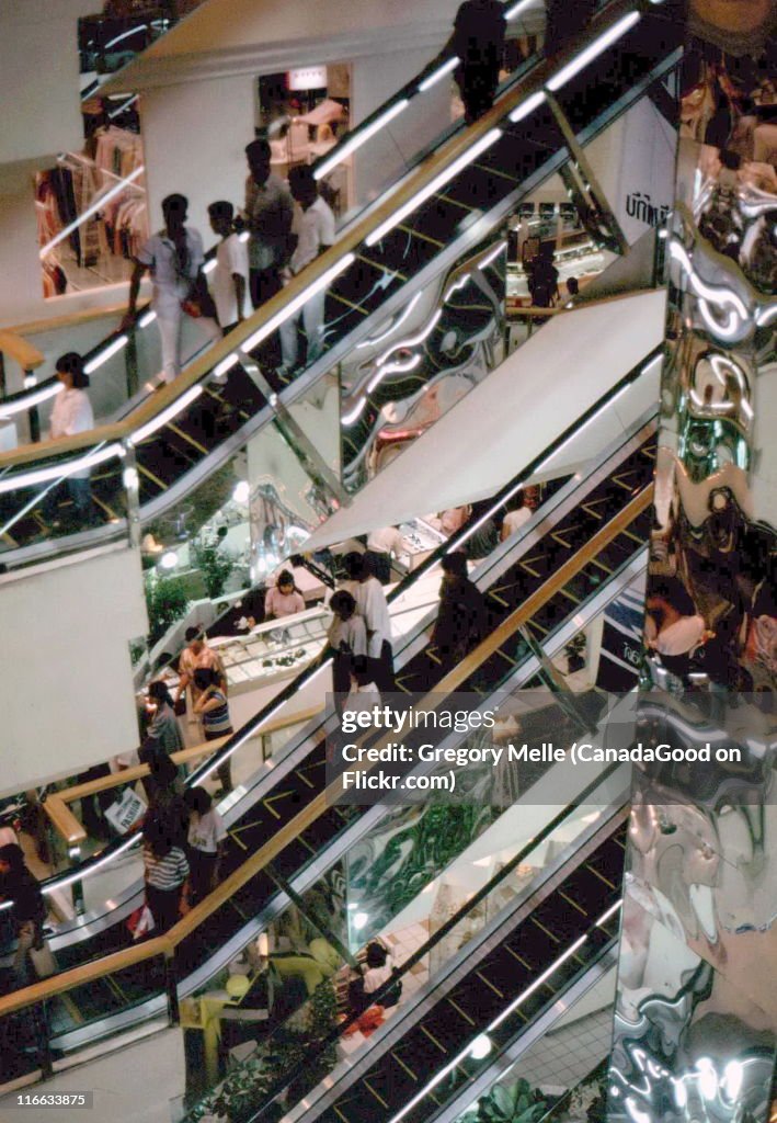 Shopping amid escalators, New World Shopping