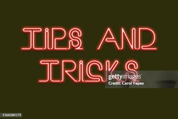tips and tricks message inneon lights - tips and tricks stock pictures, royalty-free photos & images