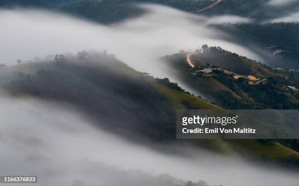 cumulus clouds brush over the early morning landscape of monteseel, blowing through the hills and valleys of this popular little town in inchanga, durban. kwazulu-natal, south africa - durban south africa stock pictures, royalty-free photos & images