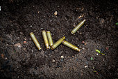 empty shotgun shells from automatic weapons ammunition scattered on the ground