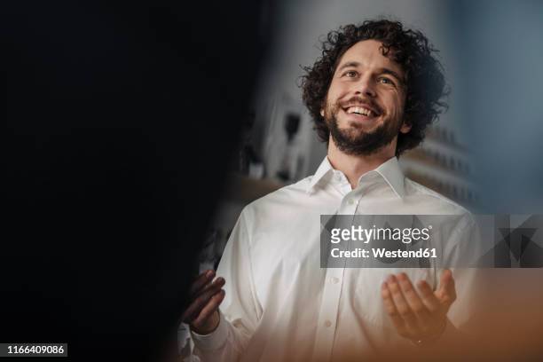 portrait of a successful young businessman - curly man stock pictures, royalty-free photos & images