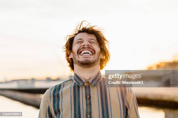 portrait of laughing at sunset - huvudet bakåt bildbanksfoton och bilder