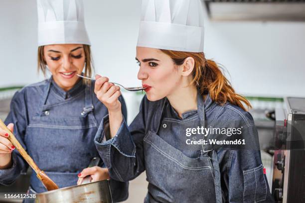 junior chefs tasting chocolate sauce - baker occupation stock pictures, royalty-free photos & images