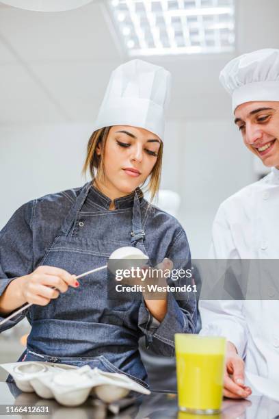 junior chefs prepairing a dessert - home economics class stock pictures, royalty-free photos & images