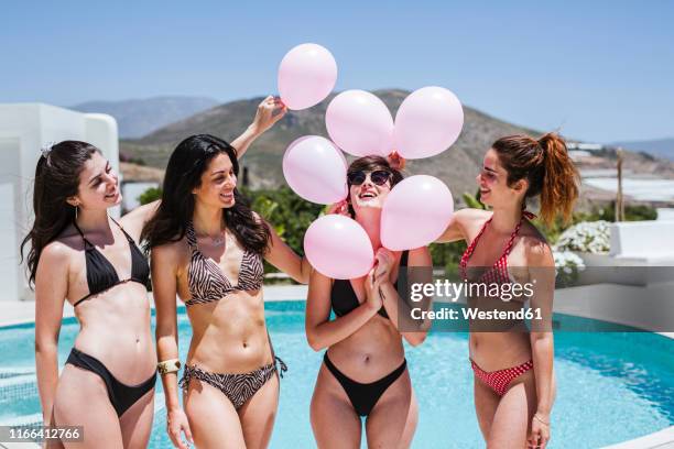 girlfriends celebrating birthday at the pool - all age party stock-fotos und bilder