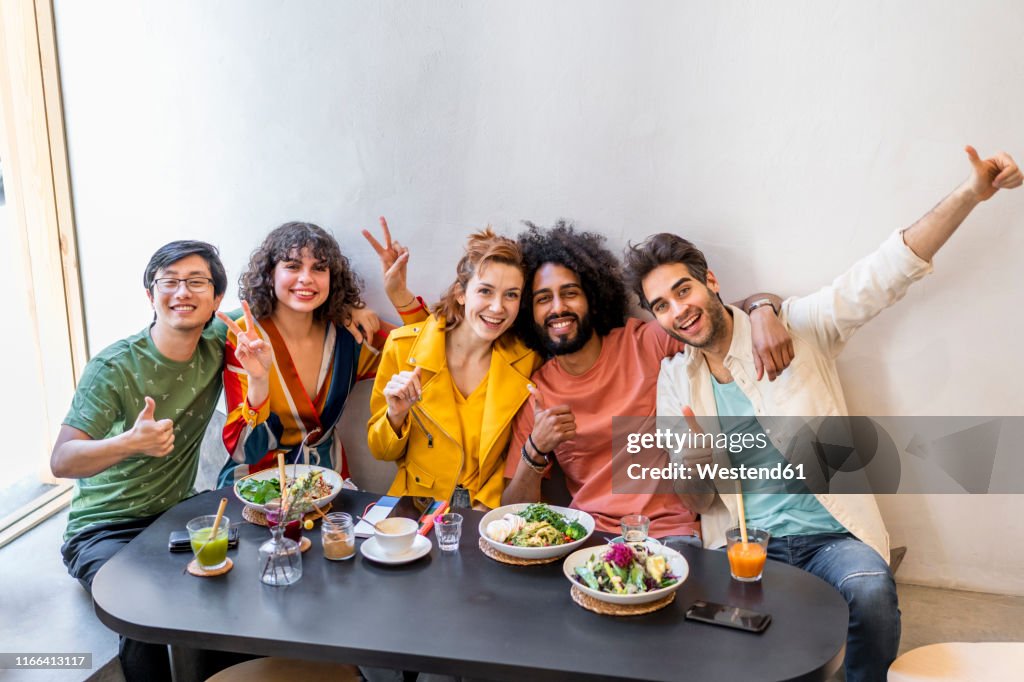 Portrait of happy group of friends in a restaurant