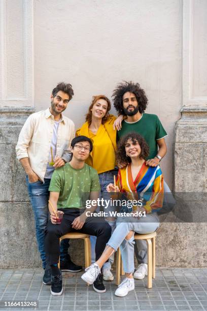 portrait of group of friends on pavement in the city - organised group photo stock pictures, royalty-free photos & images