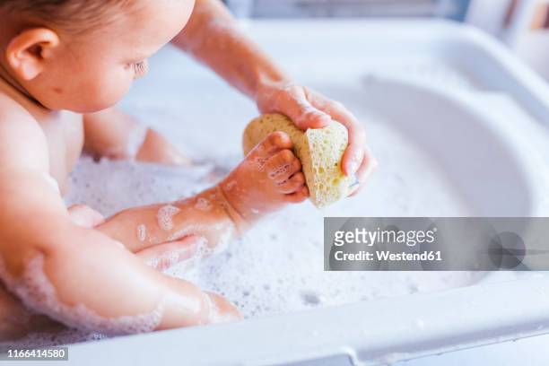 mother bathing her little son - taking a bath stock pictures, royalty-free photos & images