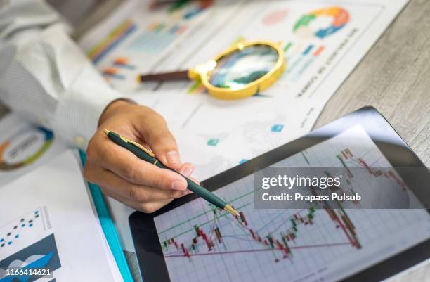 business colleagues working with computer, digital tablet, discussing and analysis graph stock market trading with stock chart data, financial and investment concept - accounting services stock pictures, royalty-free photos & images