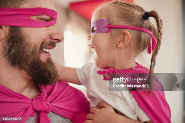father and daughter playing super hero and superwoman - 2 year old blonde girl father stock pictures, royalty-free photos & images