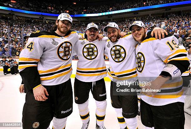 Adam McQuaid,Tomas Kaberle, Nathan Horton and Tyler Seguin of the Boston Bruins celebrate winning the Stanley Cup after defeating the Vancouver...