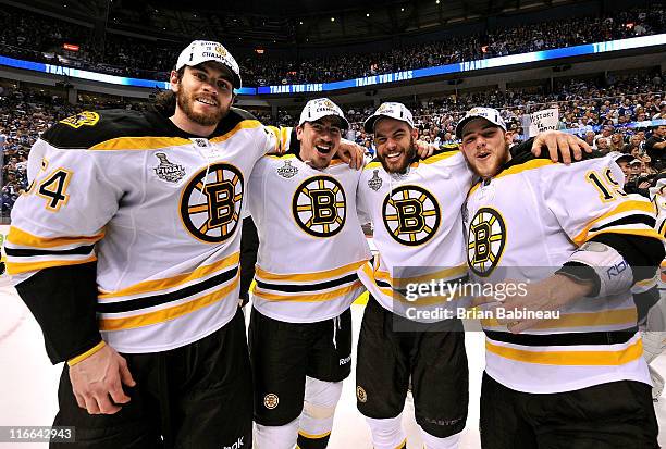 Adam McQuaid,Tomas Kaberle, Nathan Horton and Tyler Seguin of the Boston Bruins celebrate winning the Stanley Cup after defeating the Vancouver...