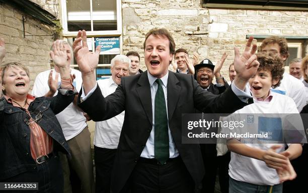 Conservative Leadership challenger David Cameron celebrates with supporters at his constituency office on October 21, 2005 in Witney, Oxfordshire,...