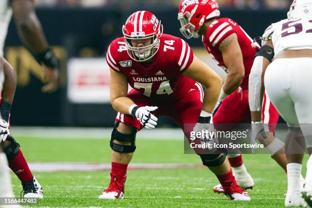 Louisiana-Lafayette Ragin Cajuns offensive lineman Max Mitchell lines up for a play during a game between the Mississippi State Bulldogs and the...