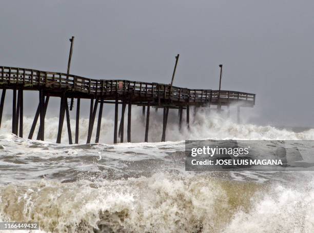 Waves crash on Rodanthe Pier as Hurricane Dorian hits Cape Hatteras in North Carolina on September 6, 2019. - The final death toll from Hurricane...