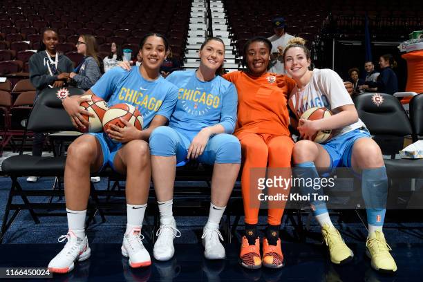Gabby Williams, Stefanie Dolson, and Katie Lou Samuelson of the Chicago Sky pose for a photograph alongside Morgan Tuck of the Connecticut before the...