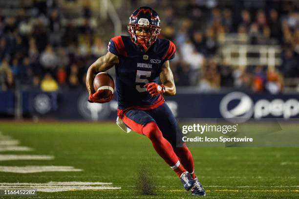 Montreal Alouettes Wide Receiver DeVier Posey runs towards the endzone with the ball during the BC Lions versus the Montreal Alouettes game on...