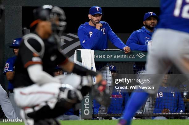 Chris Woodward of the Texas Rangers looks on from the dugout during the game against the Baltimore Orioles at Oriole Park at Camden Yards on...