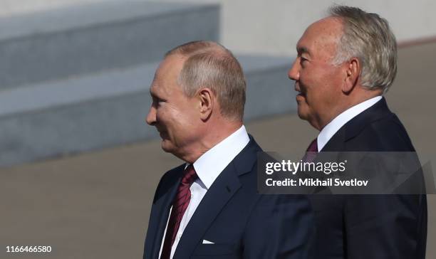 Russian President Vladimir Putin and former Kazakhstan's President Nursultan Nazarbayev attend the concert honour the City Day on September 7, 2019...