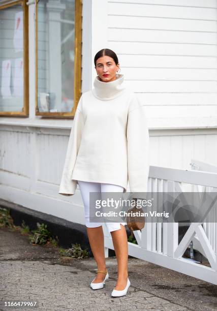 Katarina Petrovic is seen wearing white turtleneck, white pants outside Blanche during Copenhagen Fashion Week Spring/Summer 2020 on August 06, 2019...