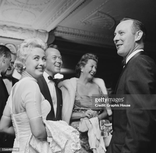 American actress and singer Jane Powell and her husband Pat Nerney at a party, USA, circa 1958. Between them is Eve Lynn Abbott Wynn, the wife of...