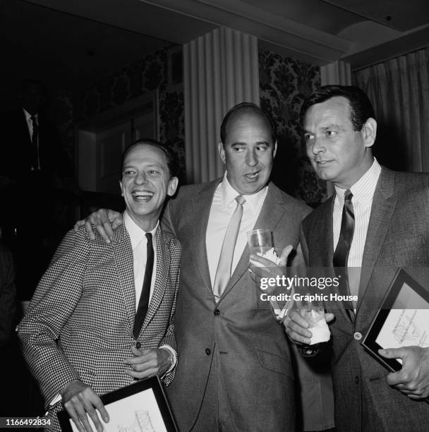 From left to right, actors Don Knotts, Carl Reiner and David Janssen at the CBS Emmy nomination party, 1966. Knotts and Janssen are both holding...
