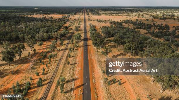 elevated perspective of a highway in the outback, western australia - western australia road stock pictures, royalty-free photos & images