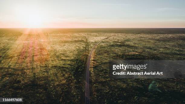 sunset over the australian outback - outback queensland stock-fotos und bilder
