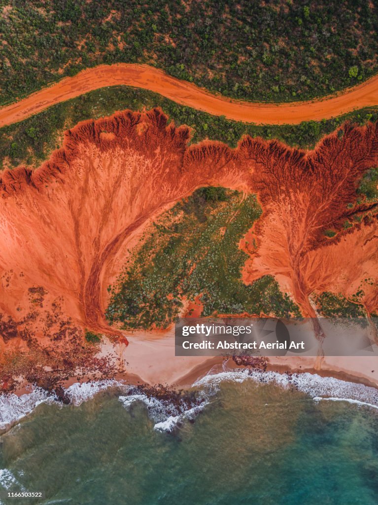 Dirt road and rock formations photographed from above, James Price Point, Australia