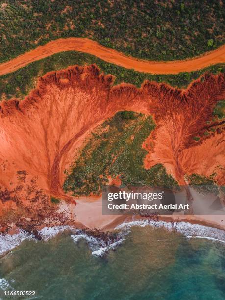 dirt road and rock formations photographed from above, james price point, australia - wilderness road stock pictures, royalty-free photos & images