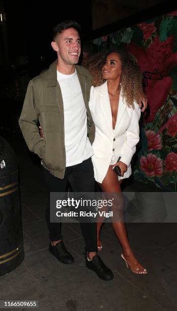 Greg O'Shea and Amber Gill seen on a night out at The Ivy Soho Brasserie on August 06, 2019 in London, England.