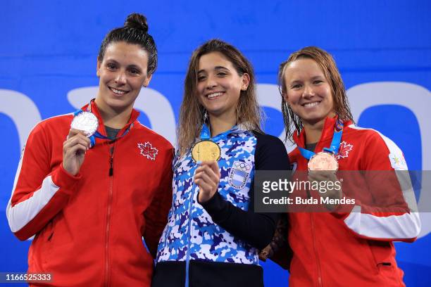 Medalists Danica Ludlow of Canada, Delfina Pignatiello of Argentina and Alyson Patricia Ackman of Canada in the podium of Women's 100m Breaststroke...