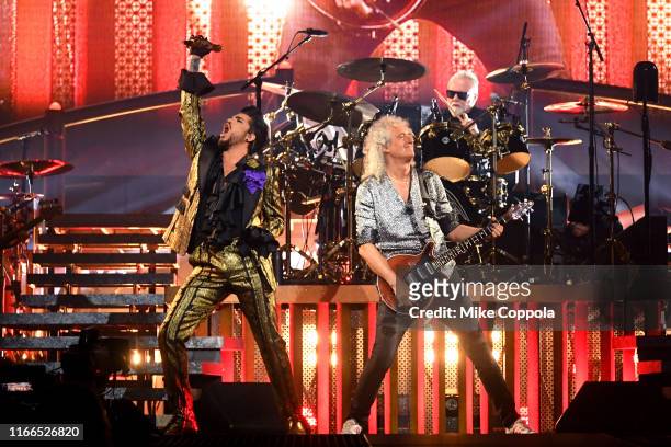 Singer Adam Lambert, guitarist Brian May, and drummer Roger Taylor of Queen + Adam Lambert perform at Madison Square Garden on August 06, 2019 in New...