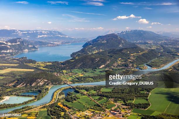 beautiful aerial view french summer landscape viewed from grand colombier summit in middle of bugey mountains in ain department, with rhone river, vibrant green fields and lake bourget in savoie - rhone river stock pictures, royalty-free photos & images