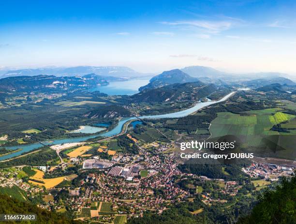 aerial view of beautiful french landscape in bugey mountains, in ain department auvergne-rhone-alpes region, with culoz small town, the rhone river and famous lake bourget in background in summer - rio rhône imagens e fotografias de stock