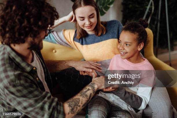 father playing with daughter - foster stock pictures, royalty-free photos & images