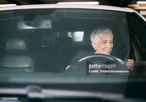 businesswoman on the move - driver front view stock pictures, royalty-free photos & images