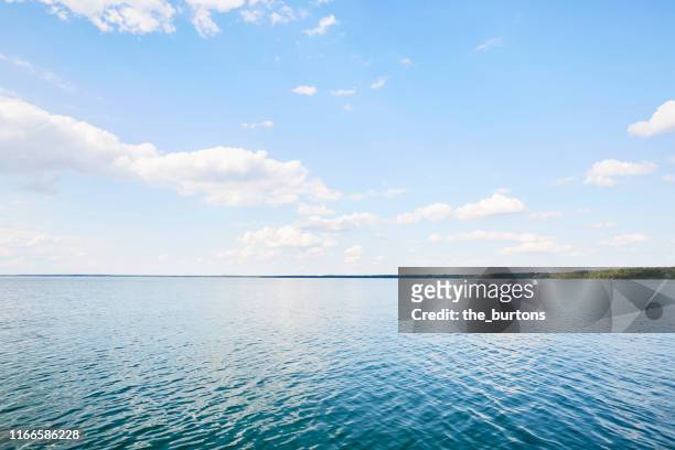 full frame shot of lake, clouds and blue sky, backgrounds - lago foto e immagini stock