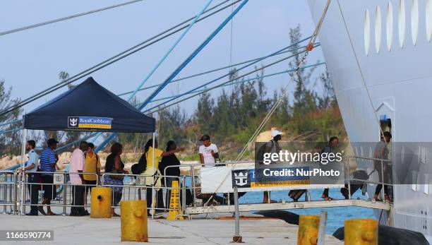 Hurricane Dorian evacuees are seen boarding Royal Caribbean International's Mariner of the Seas cruise ship on September 7, 2019 in Freeport, Grand...