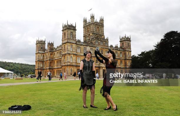 Visitors attend a 1920's themed event at Highclere Castle, near Newbury, west of London, on September 7 ahead of the world premiere of the Downton...