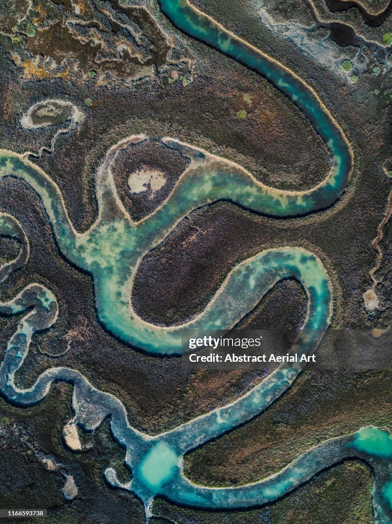 Winding water channel in the marshlands as seen from above, Venetian Lagoon, Italy